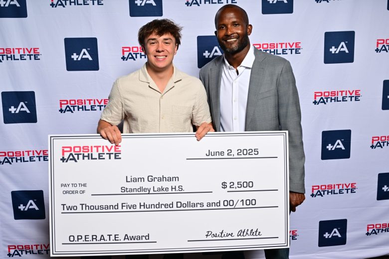 Standley Lake High School's Liam Graham was awarded a $2,500 scholarship for being the most positive male student athlete in 2025. Here, he is pictured with NFL legend Champ Bailey, who is the lead athlete for the Positive Athlete organization.