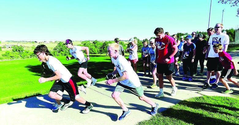 The 2022 Cardinal Club Independence Day 5K is shown beginning at Evans Park.