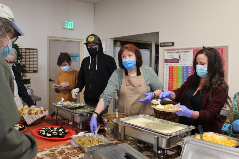 people volunteering at free meal
