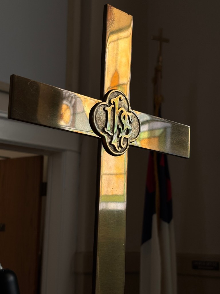 stained-glass window and cross
