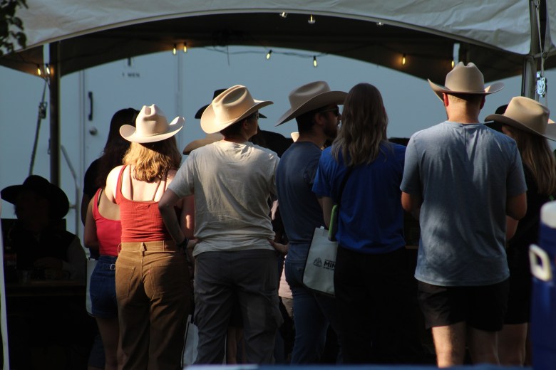 Colorado School of Mines alumni wait in line to have their Engineer's Hats branded during the Sept. 27 Blaster's Bash celebration