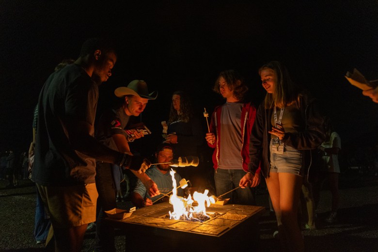 Colorado School of Mines students roast marshmallows at the annual Homecoming bonfire Sept. 27.
