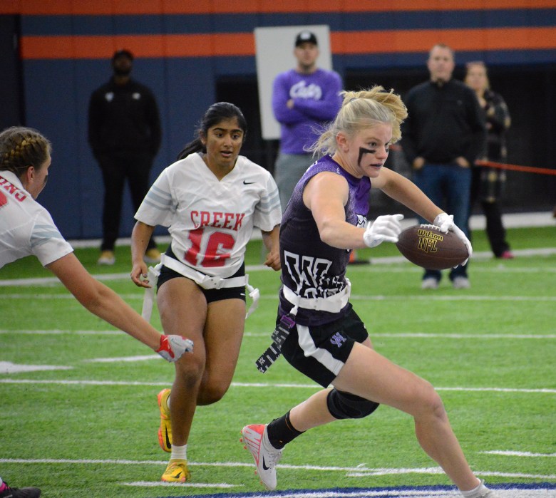 Arvada West junior Sara Walker makes some downfield moves after matching a catch during the girls flag football state championship game against Cherry Creek on Saturday, Oct. 14, at the Pat Bowlen Fieldhouse.