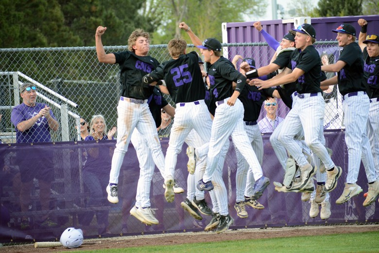 Arvada West players celebrate a solo home run by senior Tate Deal (25) on Friday, May 9, at Arvada West High School. The Wildcats won 11-1 to clinch the Class 5A Jeffco League title.