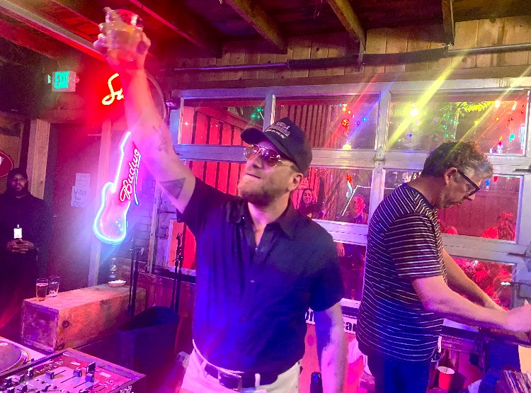 man holding drink