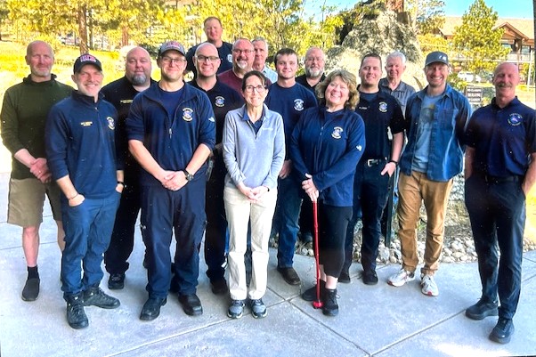 team of people standing outside