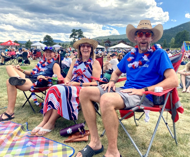 three people in red, white and blue attire