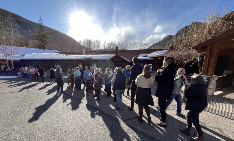 Line of people in the sunshine