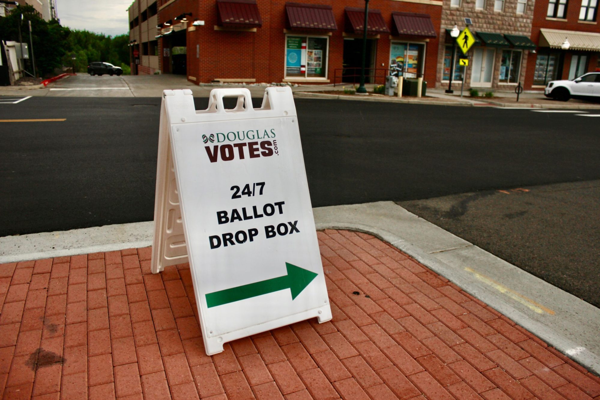 A sign for a ballot drop off location.