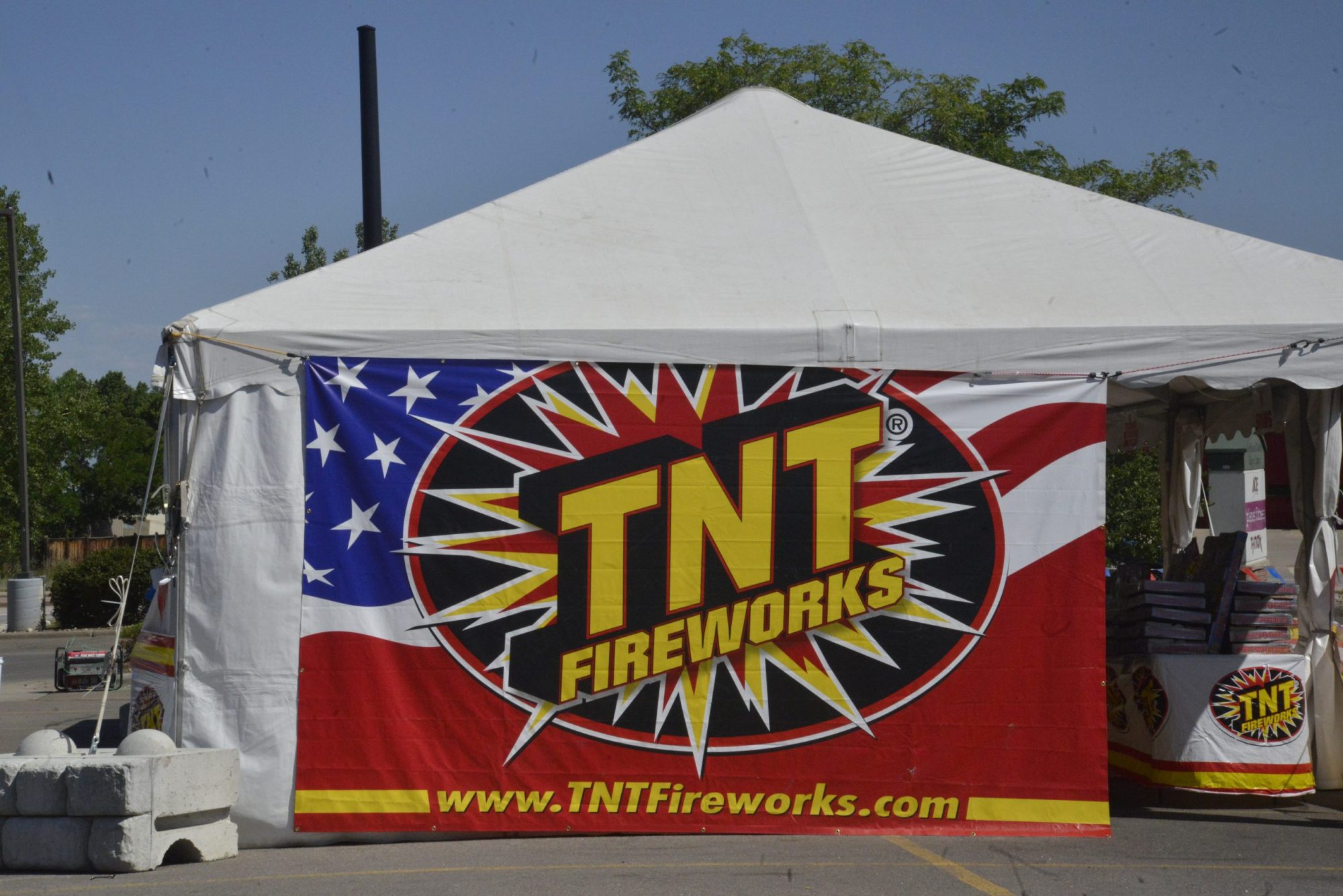 A fireworks stand in a parking lot.