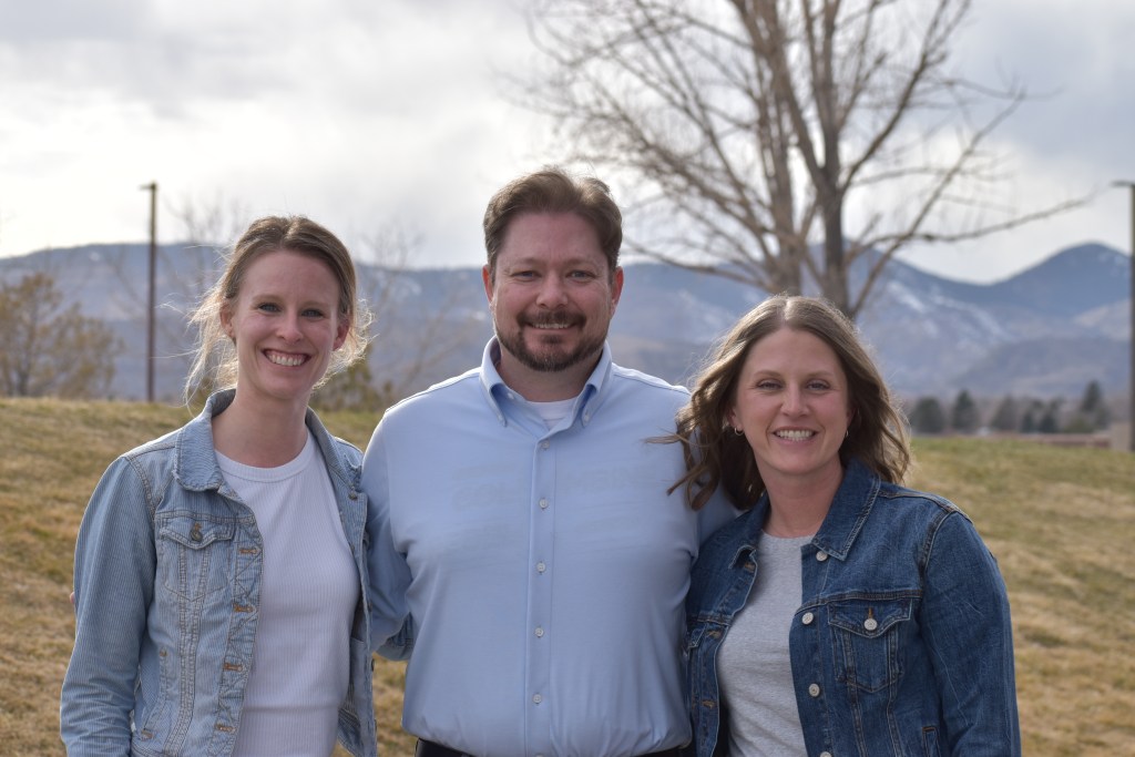Three teachers standing together.
