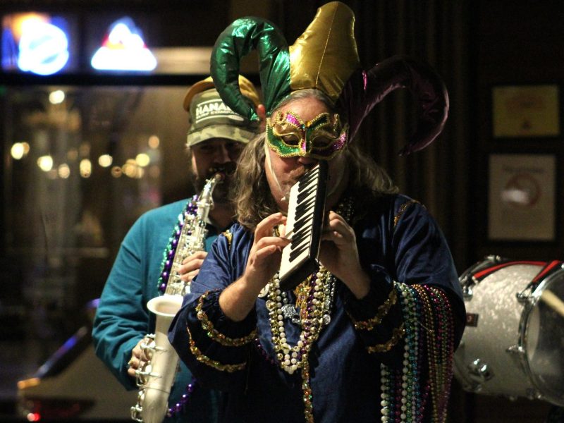 Krewe de Groove band members lead a Mardi Gras-style parade through the Buffalo Rose during the March 4 Mountain Mardi Gras concert