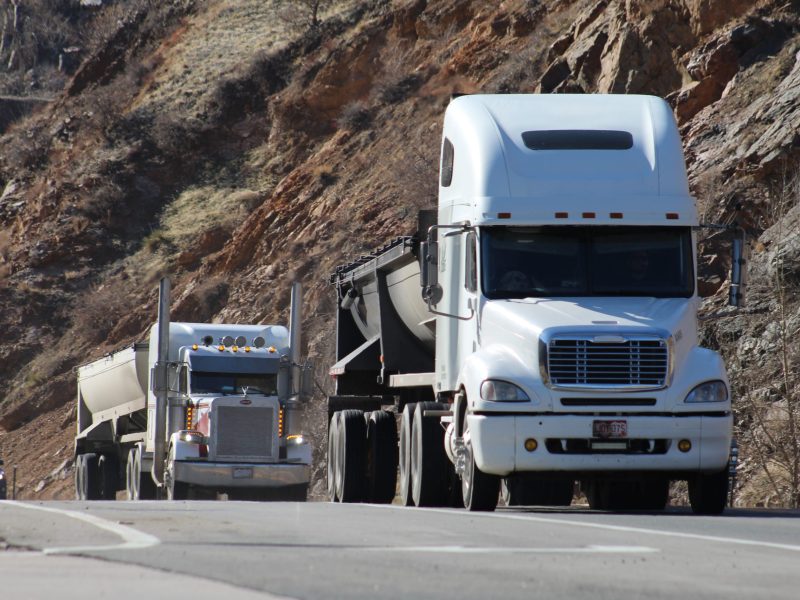 commercial trucks approach Golden city limits as they drive down Clear Creek Canyon along U.S. Highway 6