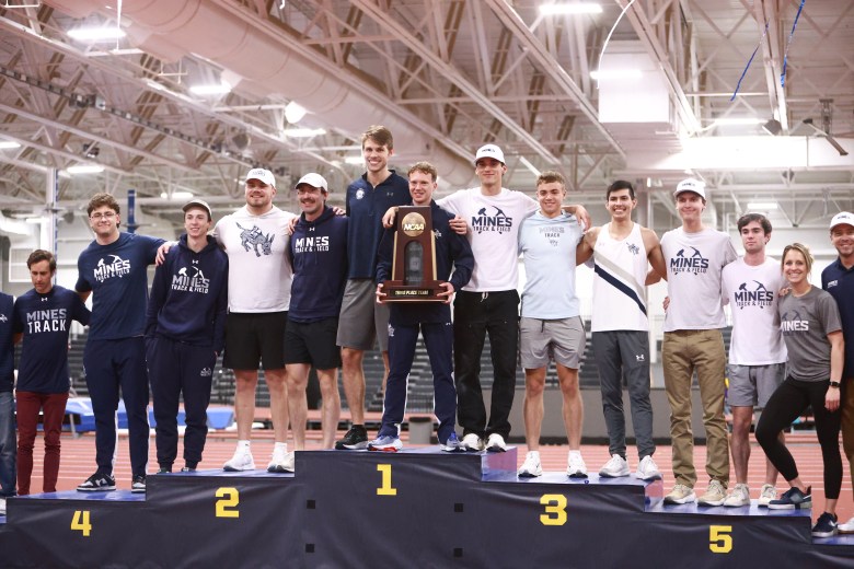 The Colorado School of Mines men's track & field team celebrates taking third place at the NCAA Division II indoor championships