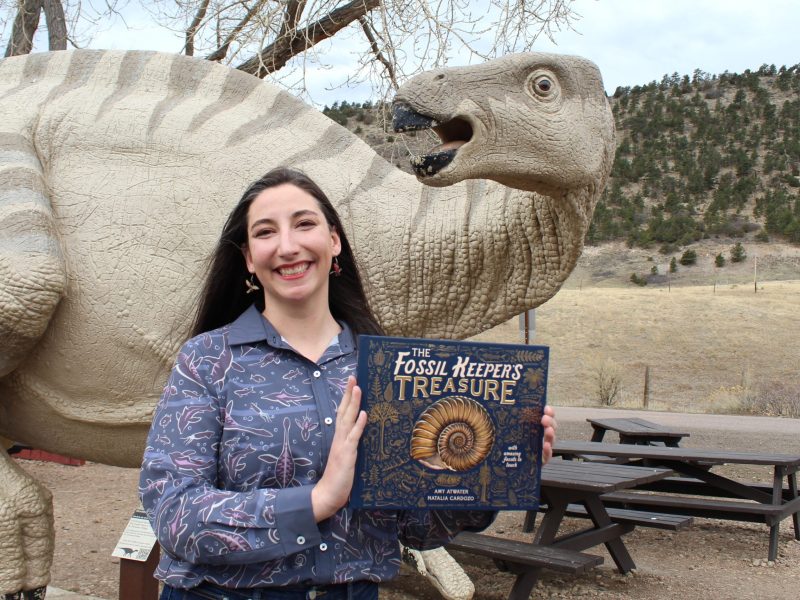 paleontologist Amy Atwater with her new children's book "The Fossil Keeper's Treasure"