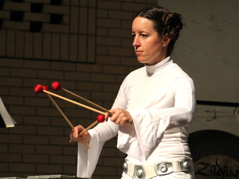 Dressed as Princess Leia Organa, Jefferson Symphony Orchestra percussionist Danielle Lehle rehearses on the vibraphone before the May 18 "Star Wars" concert