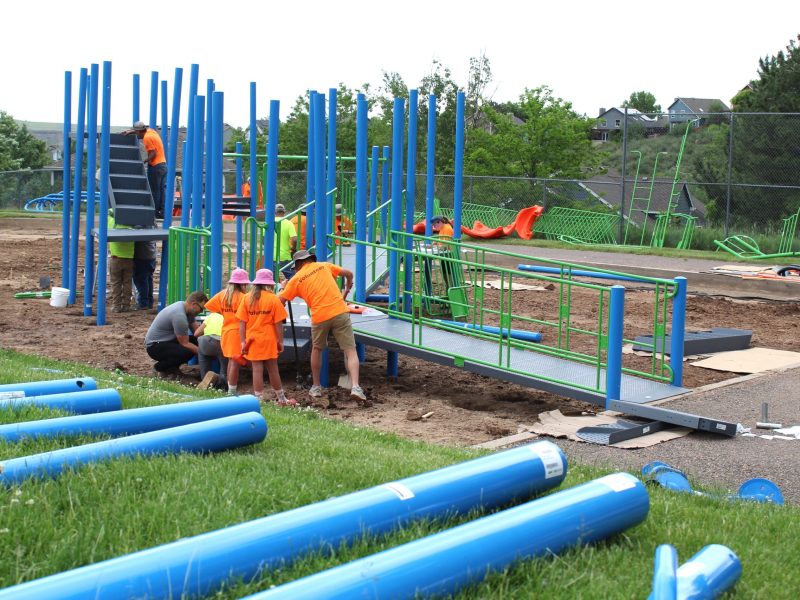 volunteers assembling playground at Golden's Shelton Elementary School
