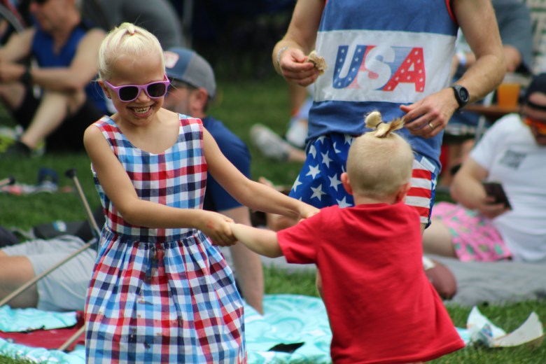 Siblings JoJo, 8, and Alex, 4, dance during Golden's 4th of July Festival at Lions Park.
