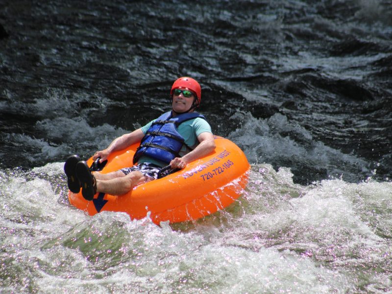 On June 28, a tuber bounces along Golden's section of Clear Creek near the U.S. Highway 6 bridge