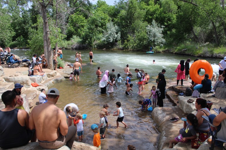 Groups of tubers, swimmers and others gather at Golden's Clear Creek Whitewater Park on June 28.
