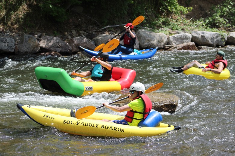 On June 28, a group of rafters pass a tuber on Golden's section of Clear Creek near the RV park.
