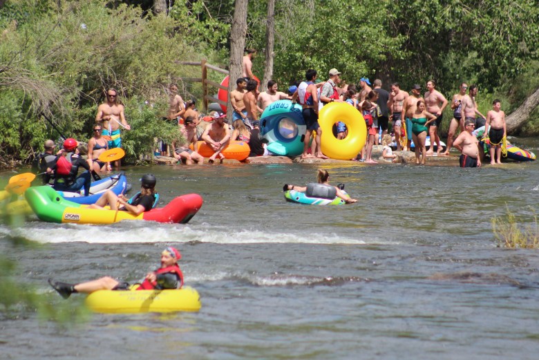 Groups of tubers, swimmers and others gather at Golden's Clear Creek Whitewater Park on June 28