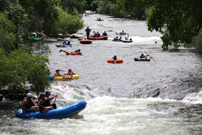 Looking west from the Washington Avenue Bridge on June 28, dozens of tubers, rafters and other creek users enjoy their day on Clear Creek.