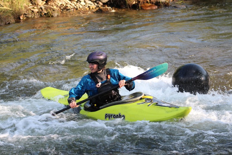 A member of Team Whitewater Wackos competes in the July 10 downriver race at the Clear Creek Whitewater Park.
