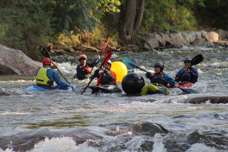Teams Whitewater Wackos and D.A.M. Ballers compete during the July 10 downriver race at Clear Creek Whitewater Park.