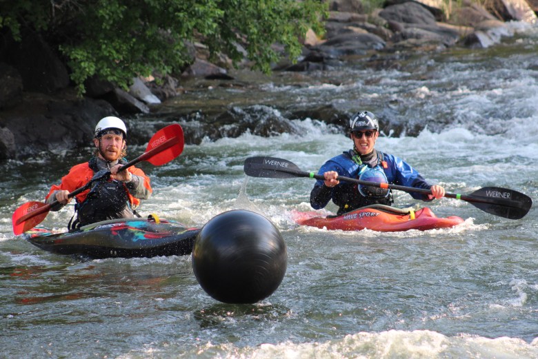 Members of Team Whitewater Wackos hit their yoga ball during the July 10 downriver race at the Clear Creek Whitewater Park.