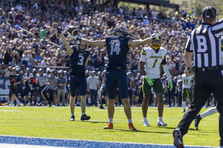 Colorado School of Mines junior wide receiver Flynn Schiele (14) celebrates a major play during the Sept. 28 Homecoming game against Black Hills State
