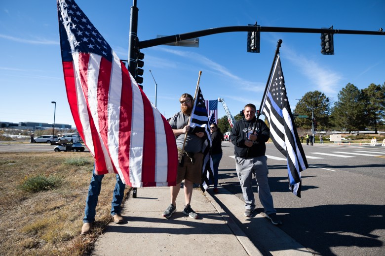 Community members show support for fallen Golden Police Officer Evan Dunn shortly before his Nov. 13 funeral procession.