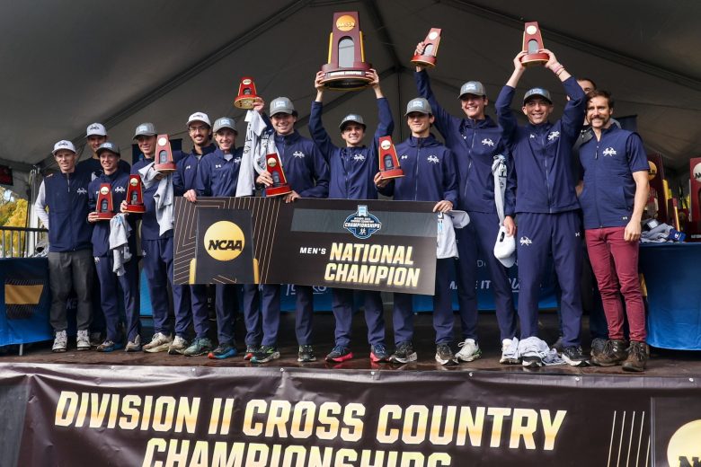 The Colorado School of Mines men's cross country team celebrates winning the 2024 NCAA Division II national title