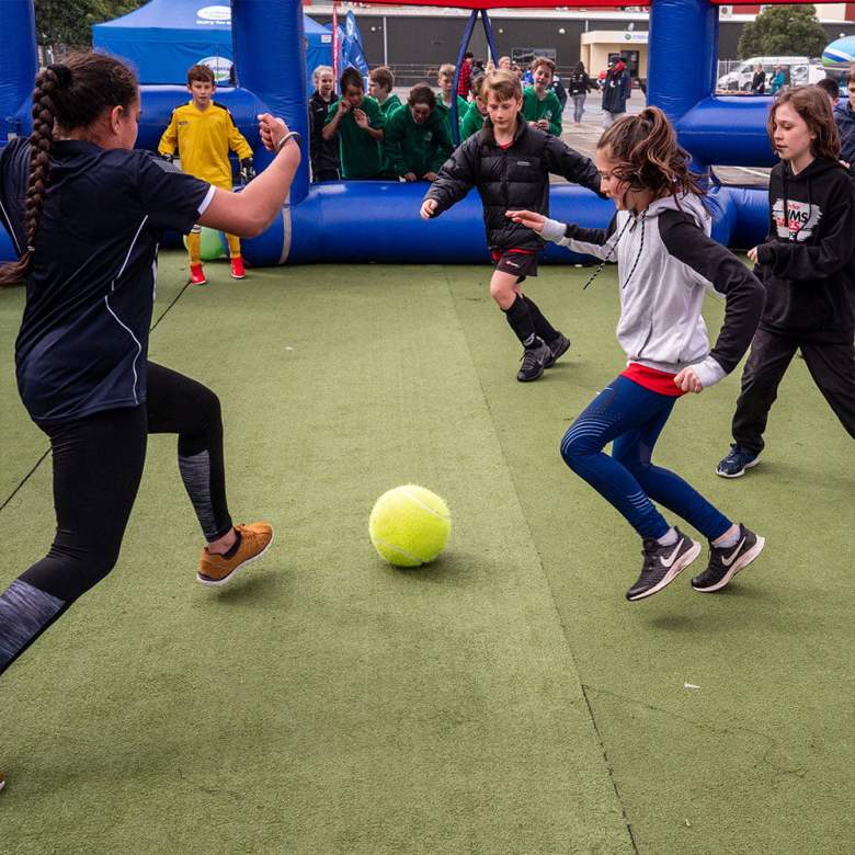 Kids play Hungerball, a game that includes elements of soccer, hockey, handball and more, in an inflatable arena. The sport first became popular in countries like New Zealand, Australia and Romania.