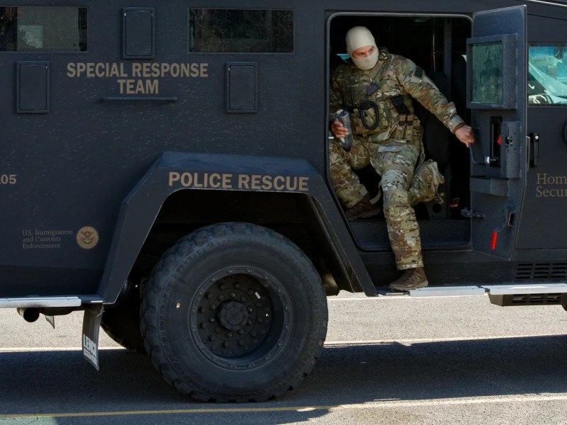 ICE Enforcement officer coming out of armored vehicle