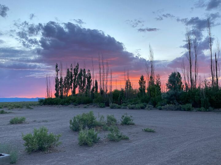 The sun sets on a perfect summer camping night at the Great Sand Dunes in Colorado.