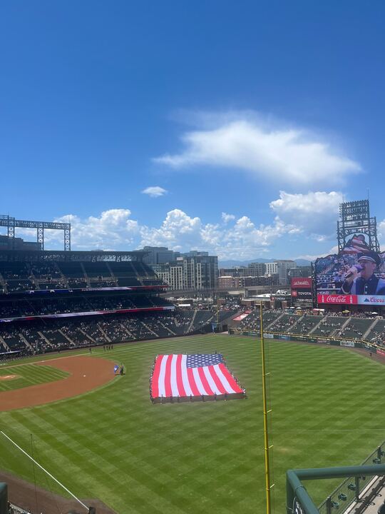 A massive on-field display of the American flag opened the Military Appreciation Game before the Colorado Rockies took on the Chicago White Sox on July 6. Colorado won 6-4.