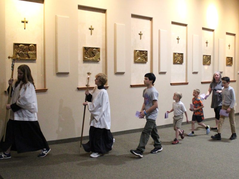 On March 28, children lead Stations of the Cross at Lakewood's Our Lady of Fatima Catholic Church as part of a Lenten tradition