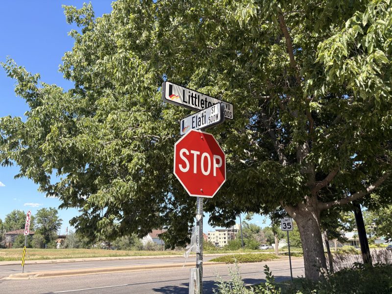 A stop sign with two street intersection signs on top