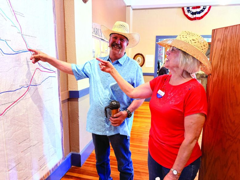 Longtime Elbert County resident Eric Whitman and Elbert County Museum volunteer Debbie Scoggin point out historical events on a museum map.