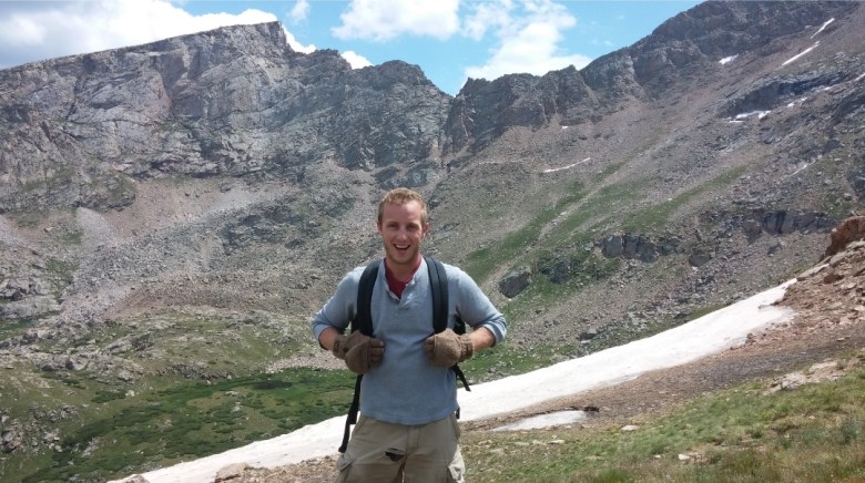 Local hiker Zachary Lundgren poses for a photo at the top of Mount Bierstadt. Lundgren recommends Bierstadt for first-time 14er hikers due to its ease and proximity to the city.
