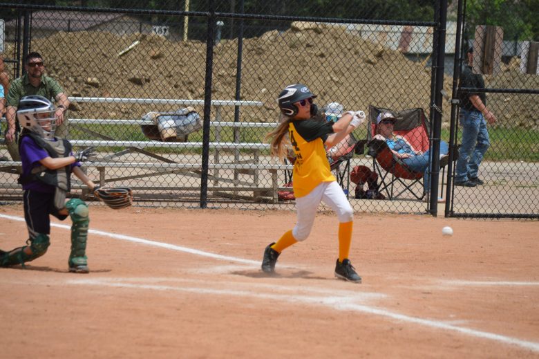 Gilpin County's Eowyn Peterson gets a base hit early in the game in Idaho Springs on June 29. Gilpin County won 9-4.