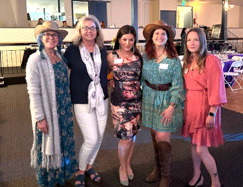 five women standing
